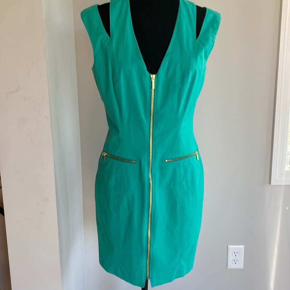 Bebe size 8 Green women’s dress with gold zippers runs like a size 6